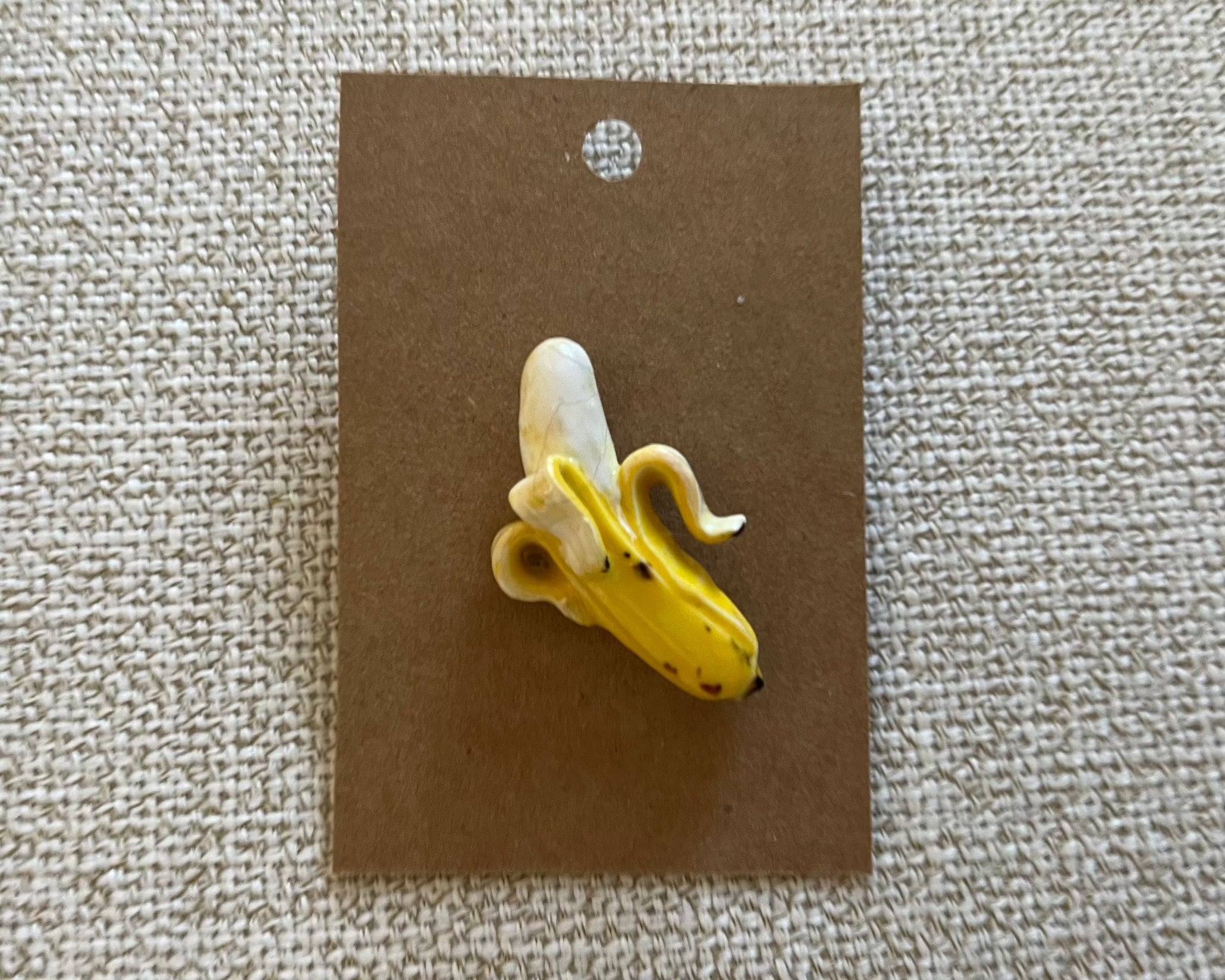 Banana handmade polymer clay brooch pin paper background