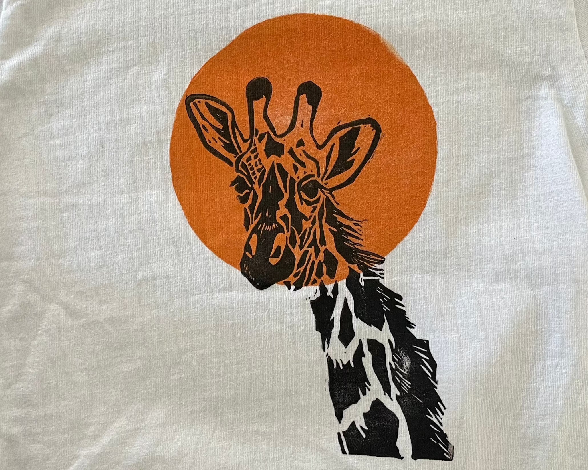 Hand printed giraffe and sun block print toddler t-shirt close up