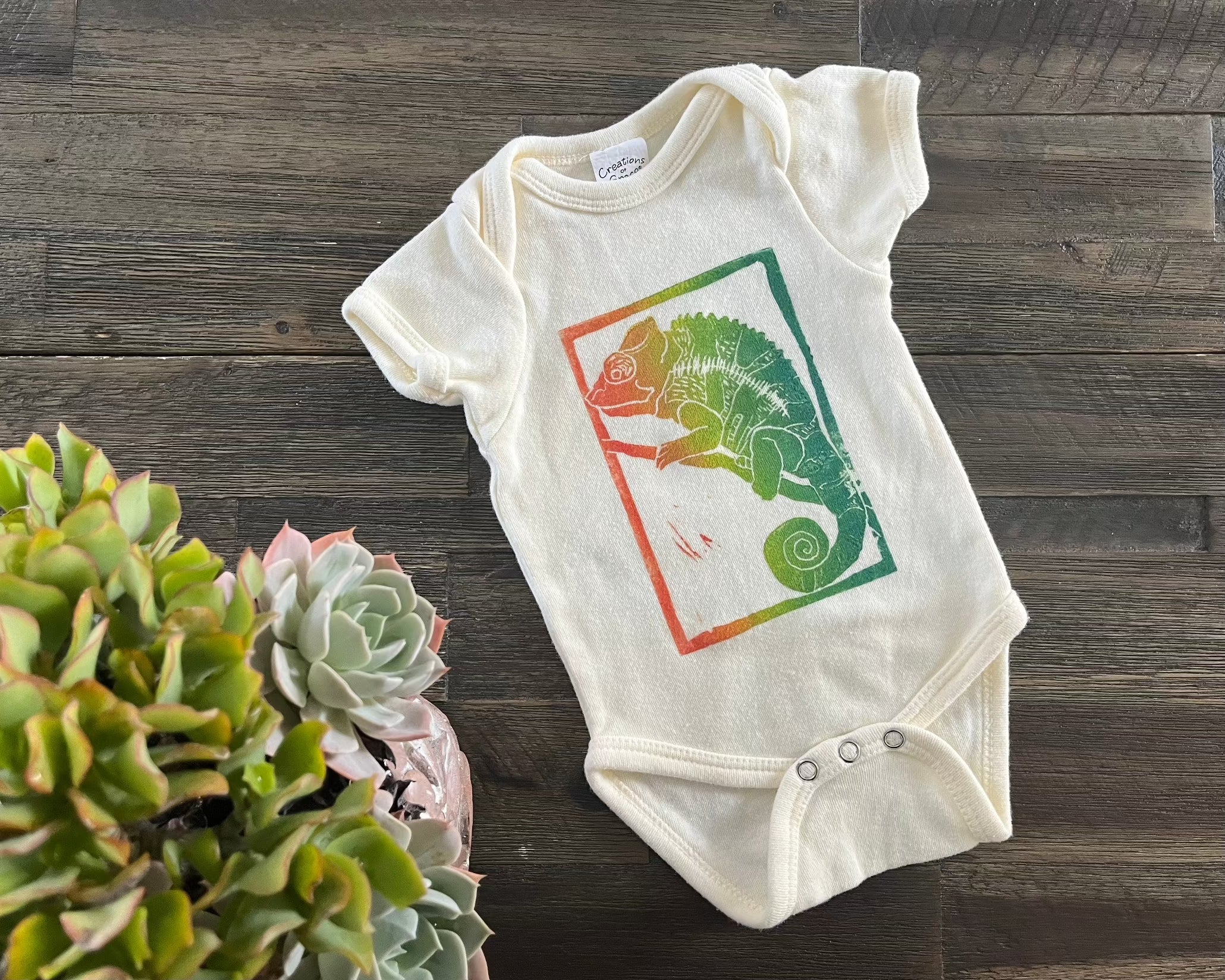 Chameleon block print baby onesie  