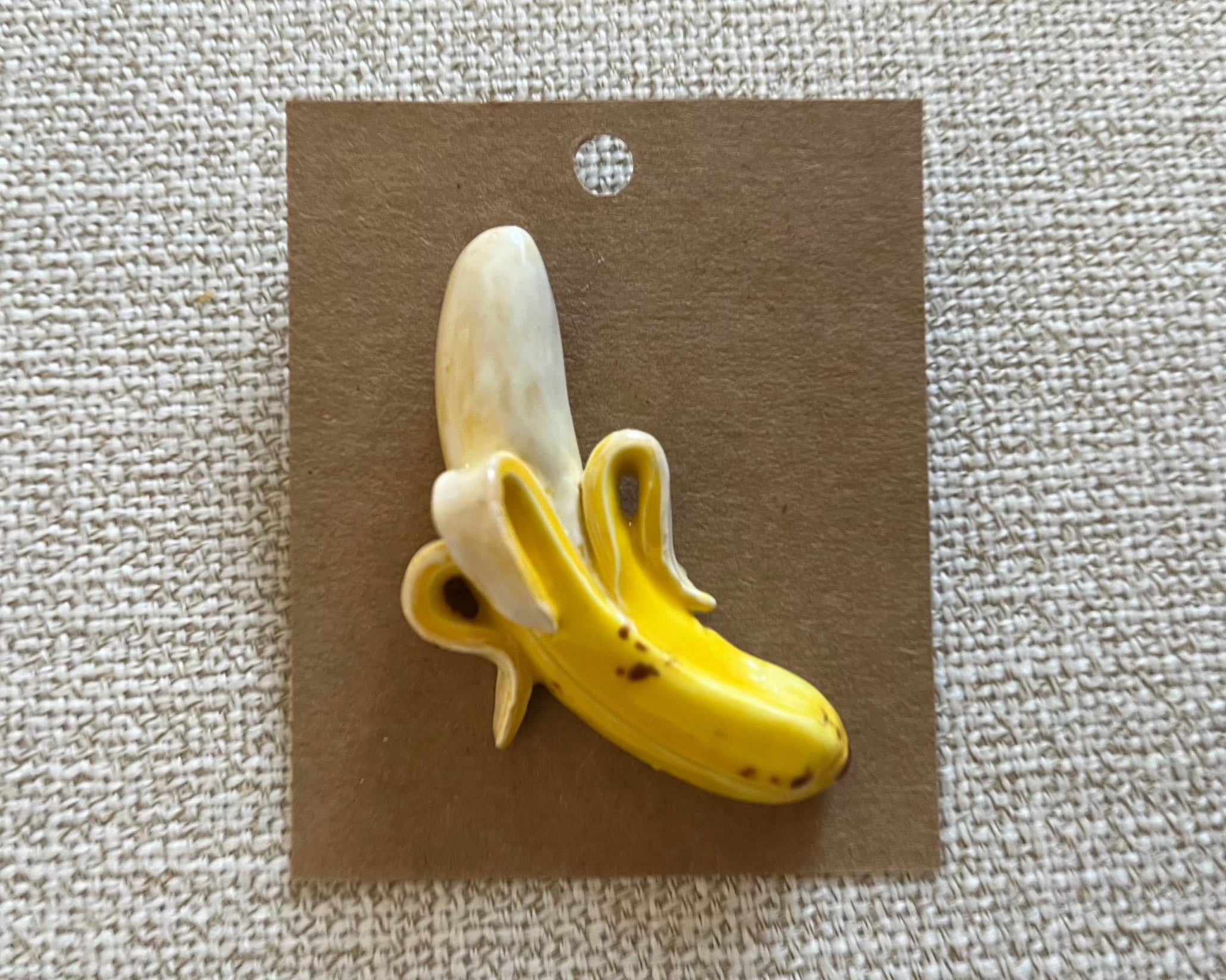 Banana handmade polymer clay brooch pin paper background