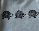 Hand printed hedgehog block print baby onesie close up