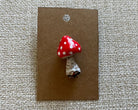 Handmade mushroom polymer clay brooch pin paper background